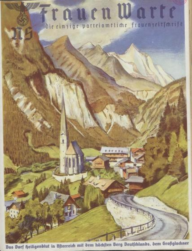 Ein altes deutsches Reiseplakat aus den 1930er Jahren, das eine kleine Bergstadt mit Häusern, Bäumen und einer gewundenen Straße zeigt, begleitet von beschreibendem Text.