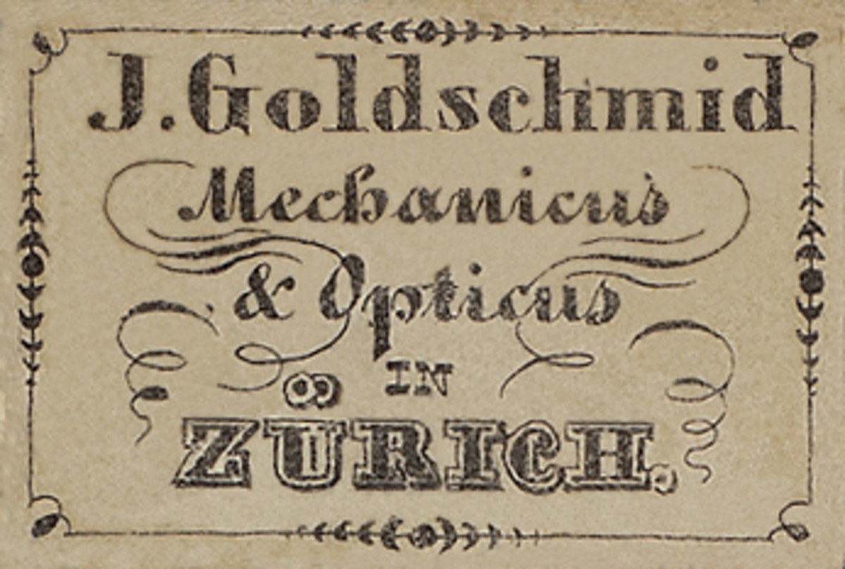 Alte Visitenkarte für "J. Goldschmidt Mechanicus & Optics in Zürich", wahrscheinlich aus den frühen 2000er Jahren, die die Dienstleistungen des Unternehmens auflistet.